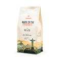 Coffee bag with 'Back to the Essence' branding and a scenic design on a white background