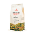 Coffee bag with scenic design and 'Back to the Essence' branding on a white background