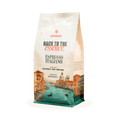 Coffee bag labeled 'Back to the Essence Espresso Italiano' with scenic design on a white background